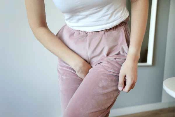 woman running for the toilet because of urinary incontinence Solihull Lodge
